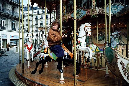 A good old merry-go-round on the City Hall Square - Kiti enjoying!